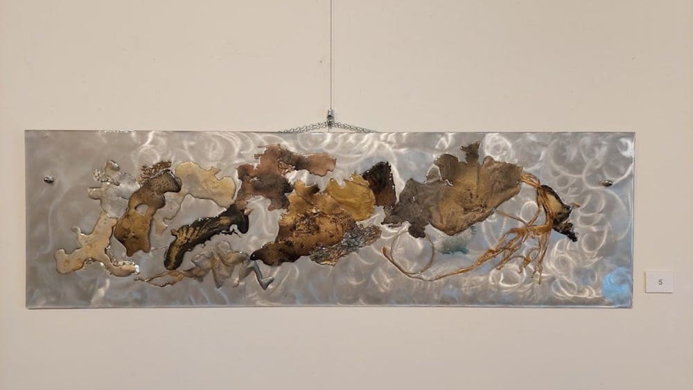 Resin artwork in silver and earthy tones