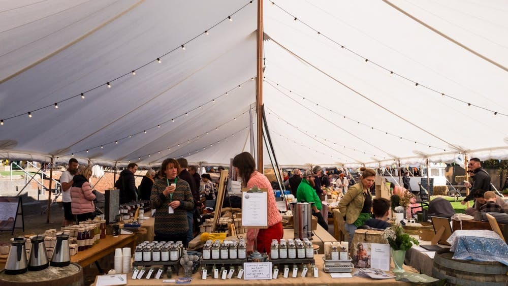 Market stall filled with vendors and produce