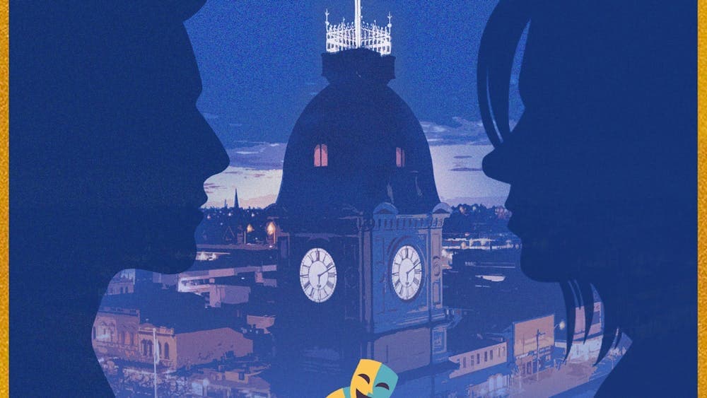 A silhouette of a young couple against the ballarat skyline at night