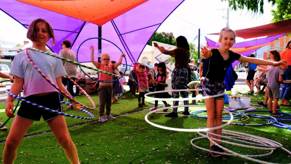 Group of kids playing with hula hoops