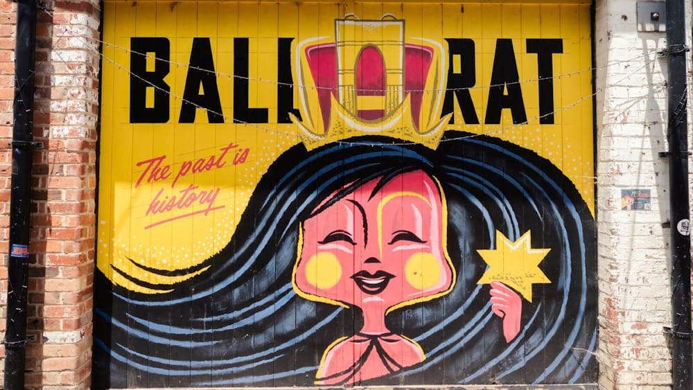 a red and yellow coloured mural