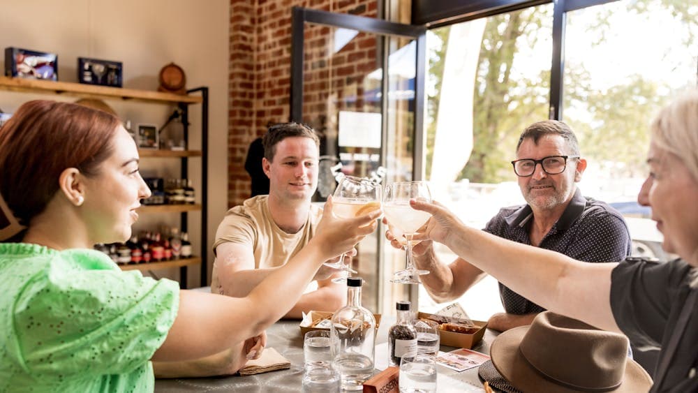 a family of four having a toast