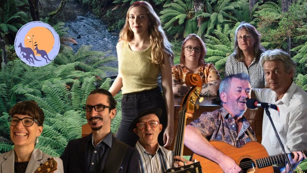 Group of smiling musicians against a lush Otways background