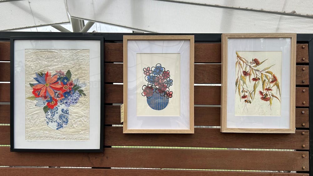 Floral Artworks on display against a wooden background