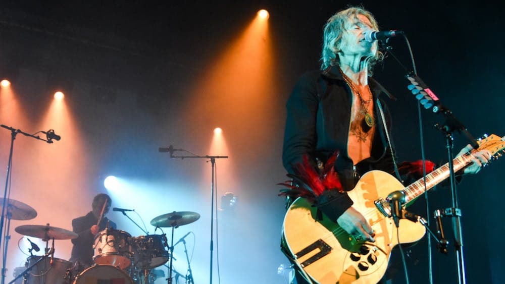 Tim Rogers in front of Rusty Hopkinson, the drummer