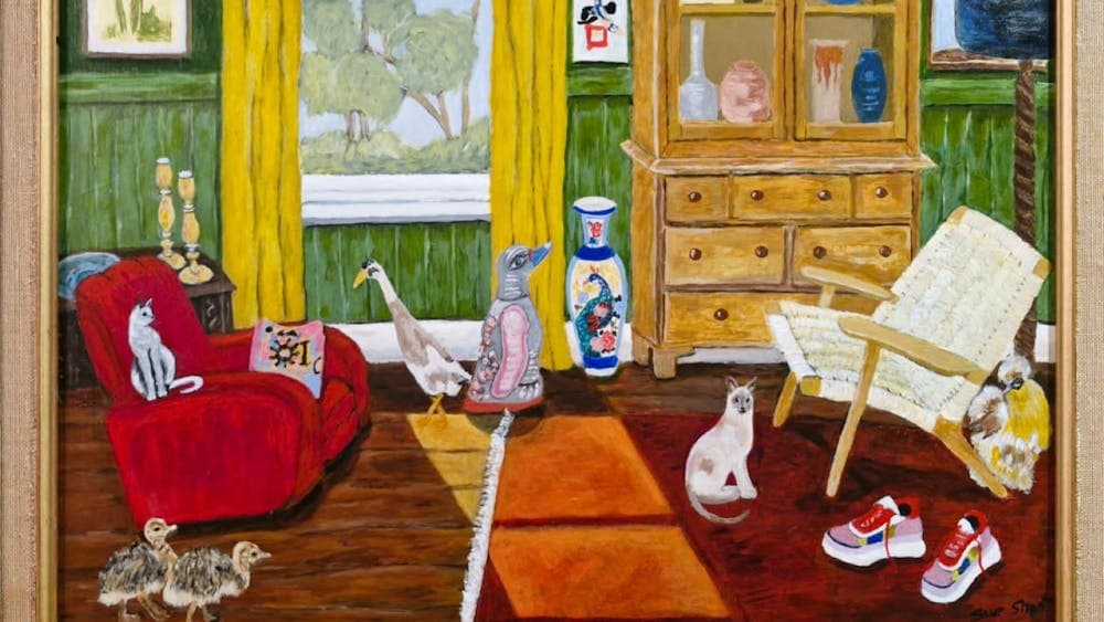 Vibrant interior with green walls and yellow curtains, a display cupboard and cats, chicks and birds