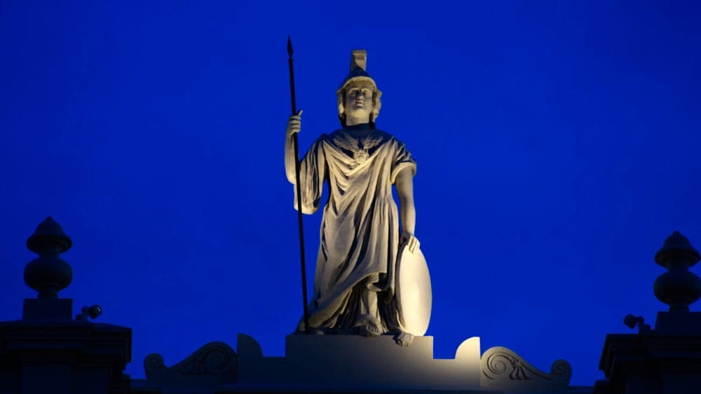 Statue of Minerva at top of building