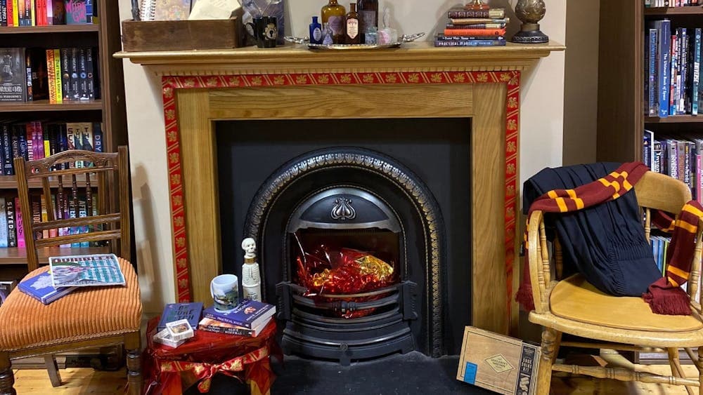 A fireplace decorated to look like a room at Hogwarts