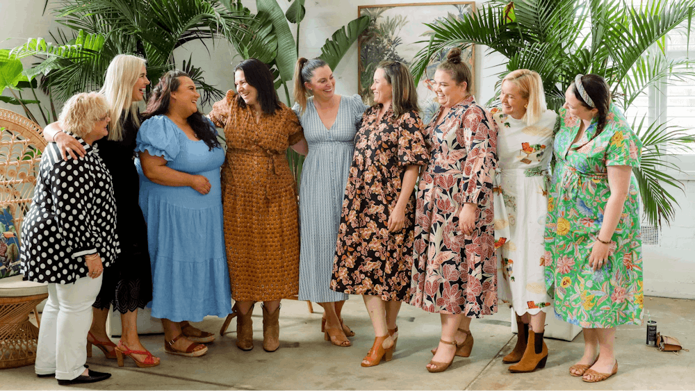 Ten women joining in a good laugh