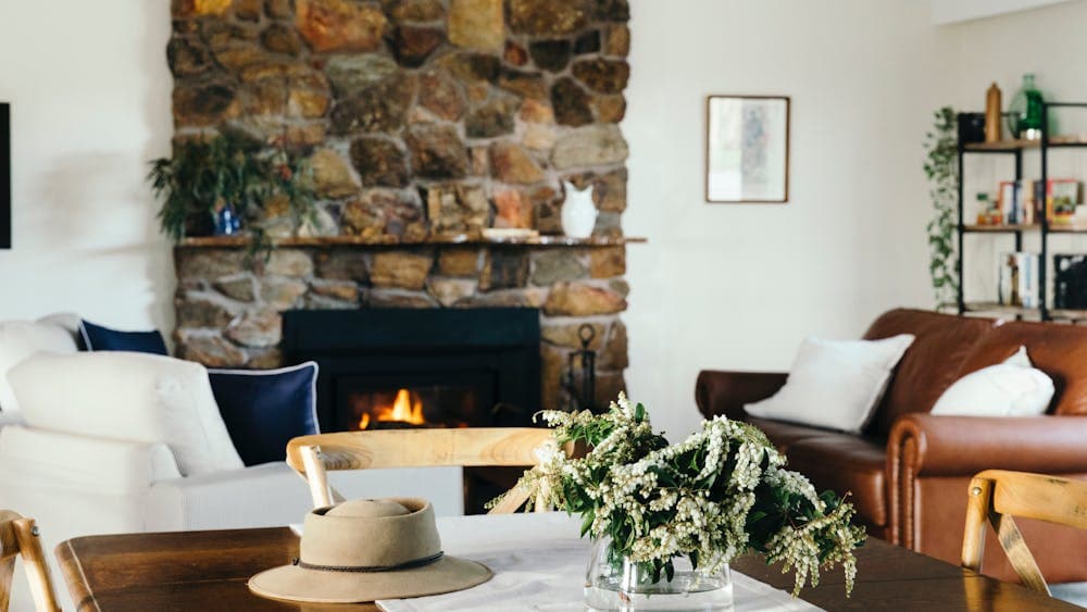 Stone fireplace, generous and comfy sofas, country farmhouse