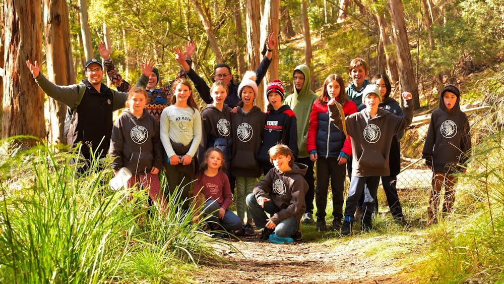 Winter Campers gather in the bush for a group photo