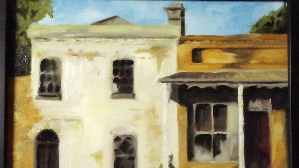 Old stone shops in cream and brown  one with a verandah