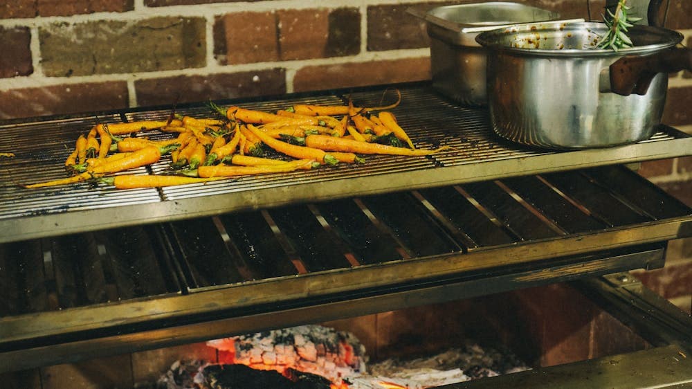 Carrots cooking over fire