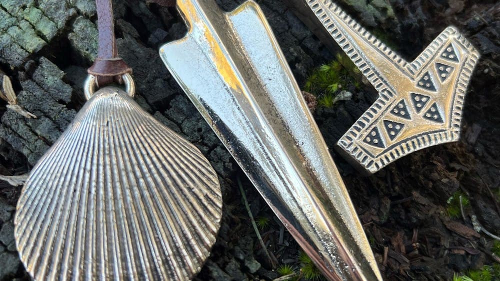 Three metal pendants