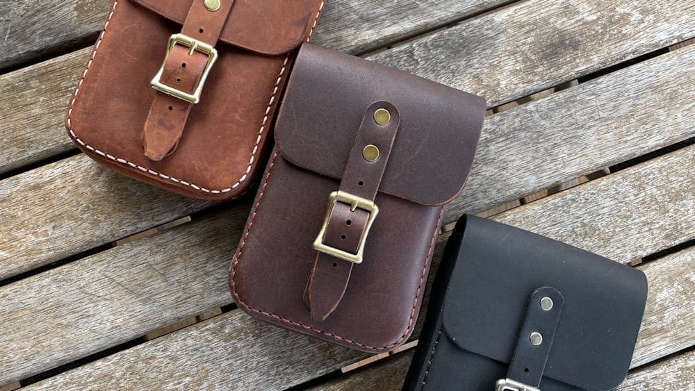 Three buckled leather in tan, brown and black