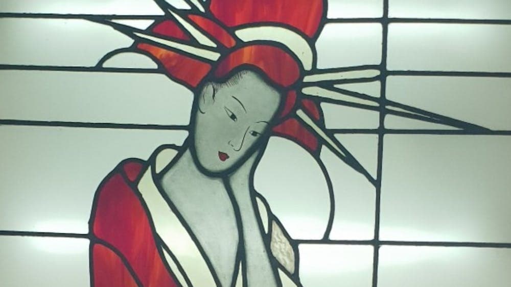 Leadlight window featuring a Japanese Geisha in a red robe and headwear