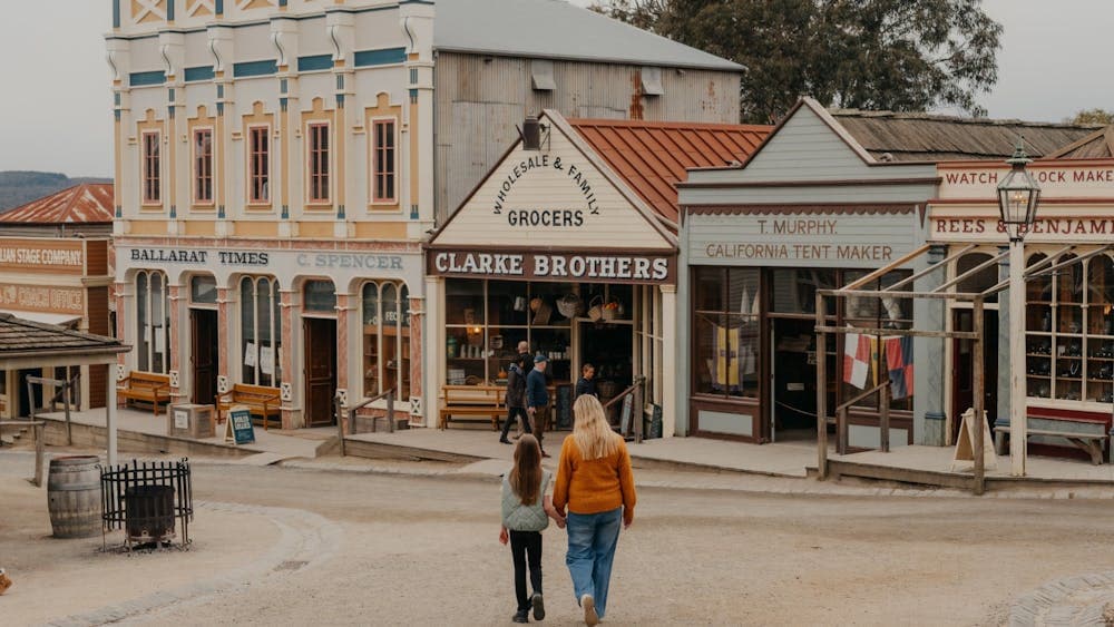 Mother and daughter walking towards Sovereign Hill shops on Main Street
