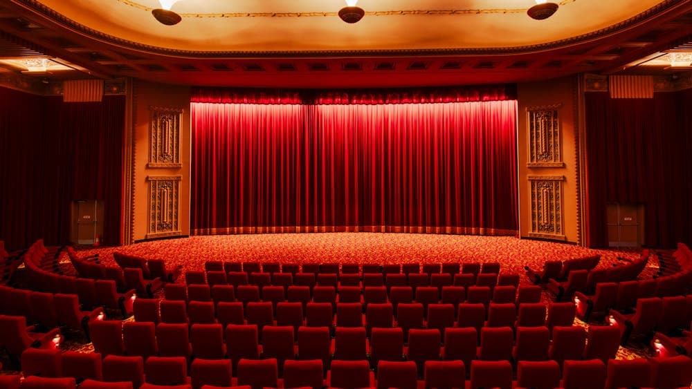 Inside of a cinema facing the curtains