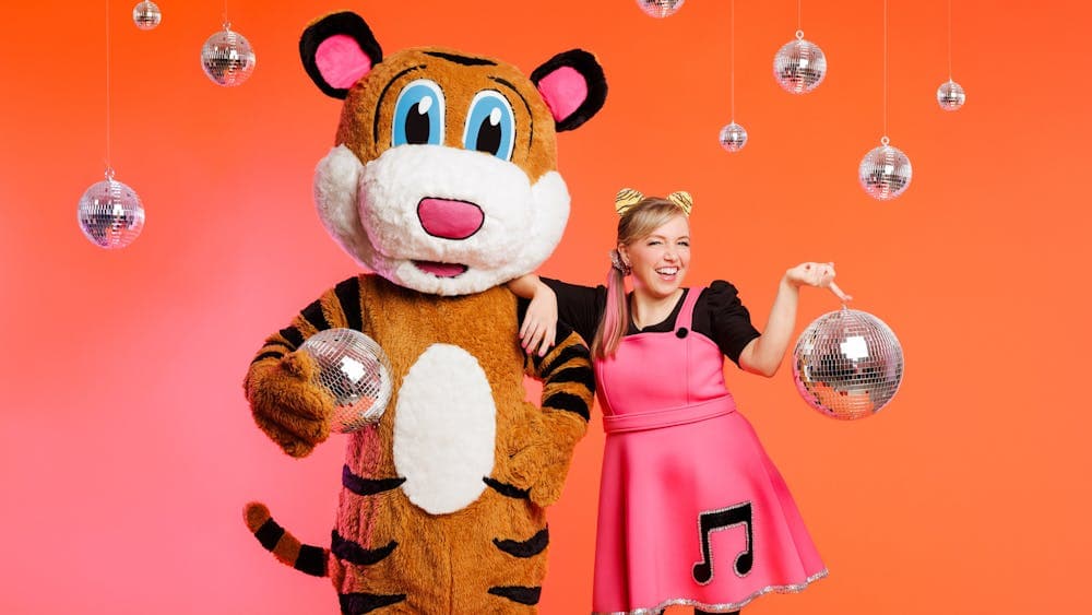 A picture of Pevan & Sarah holding and surrounded by disco balls