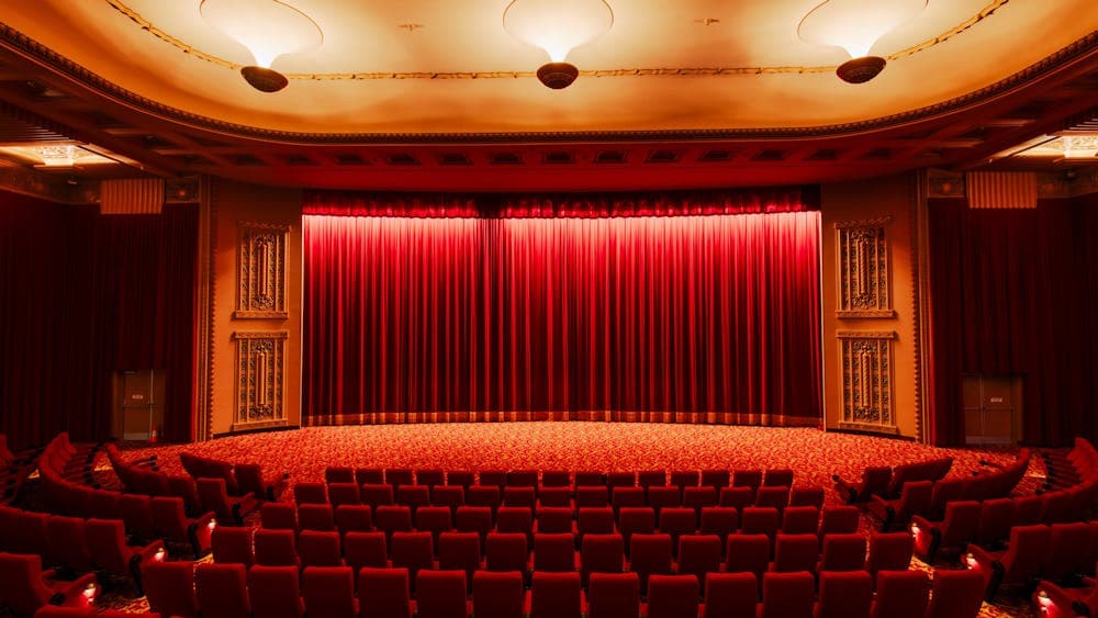 Inside of a cinema facing the curtains