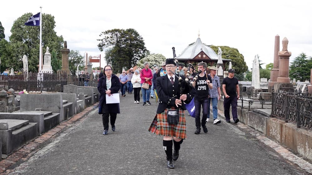 Ballarat Old Cemetery Eureka procession led by bagpipe player Sue Brant