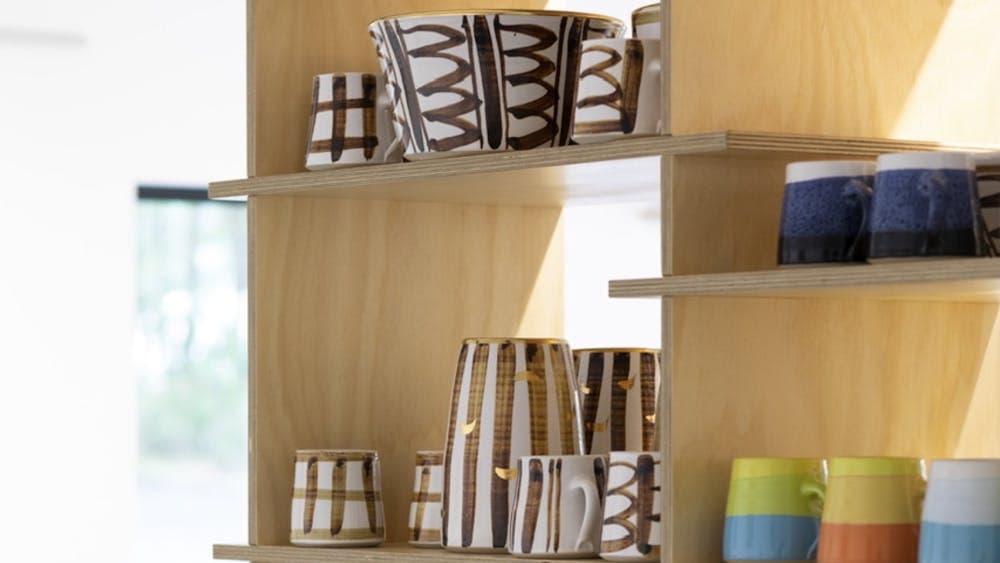 Colourful pots on shelves
