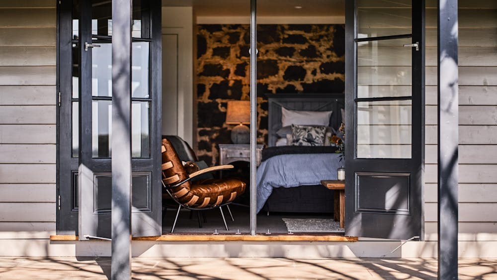 The cabin is a connected be separate part of the house with its own bathroom and kitchenette