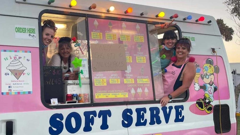 Four ladies smiling inside a ice cream van