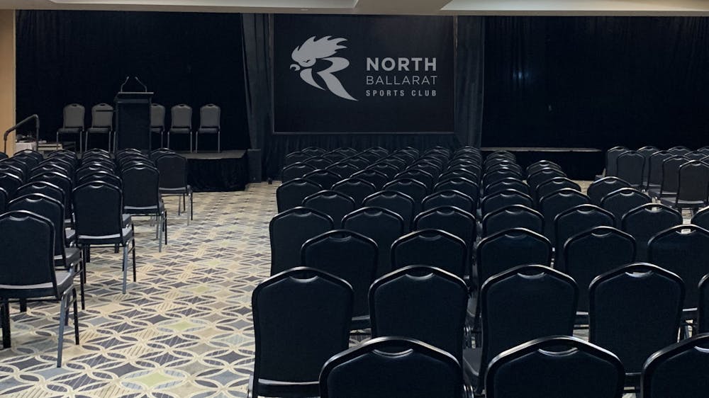 Chairs in rows facing the front of the room