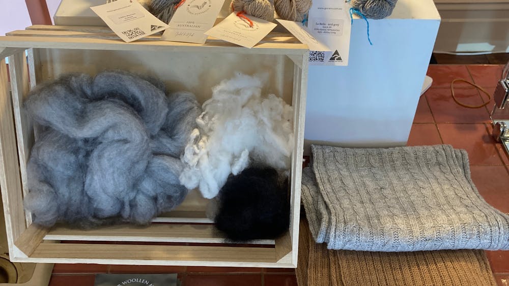 yarn and raw wool on  display within a shop environment