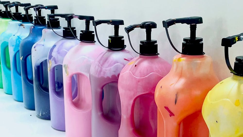 Colourful paints displayed in the art room at The Art Club Hub