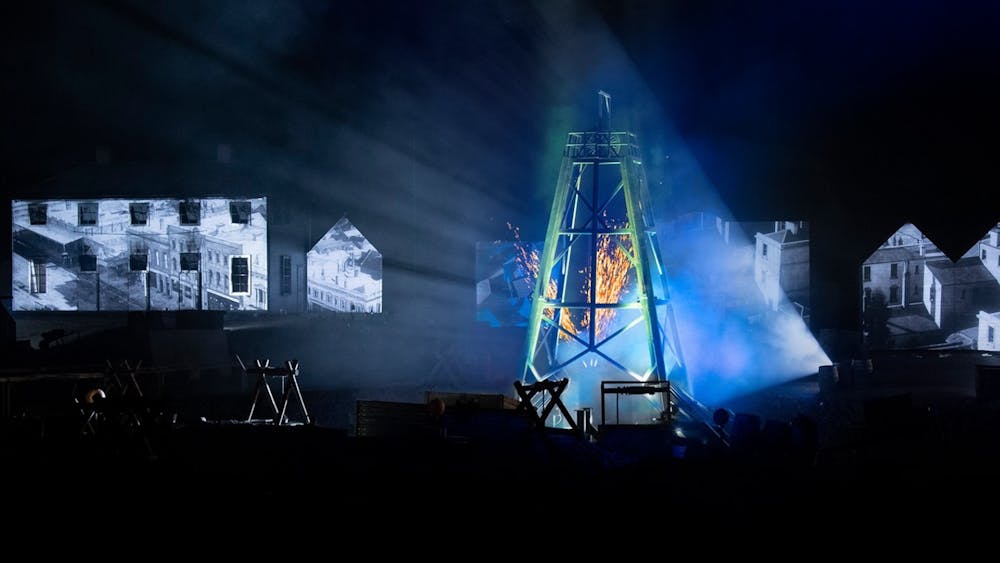 Light projections on poppet head and building in AURA sound and light show