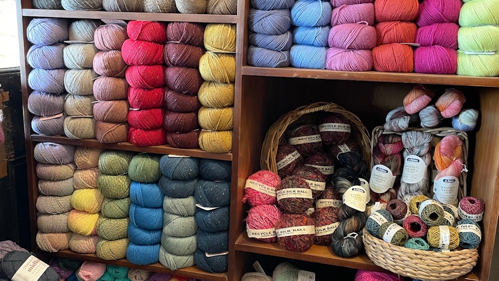 spools of yarn placed on shelves