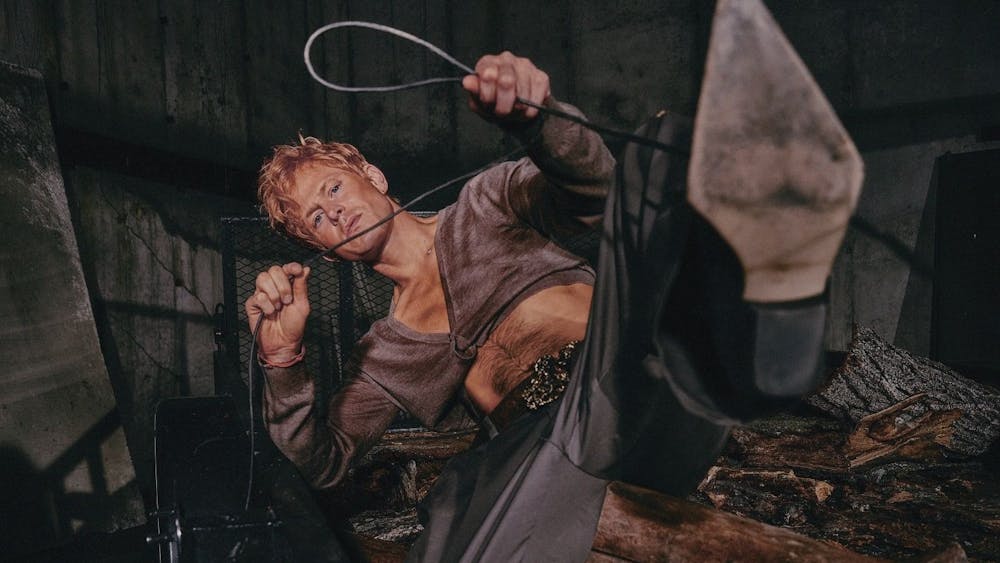 Perfume Genius in a snazzy midriff and wearing heels