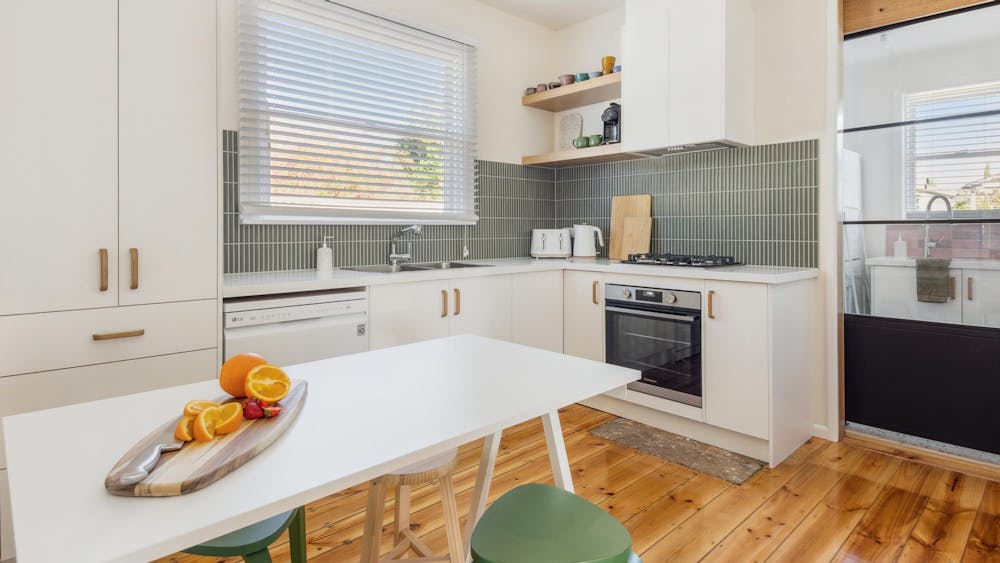 Kitchen, oven, cooktop, sink and window