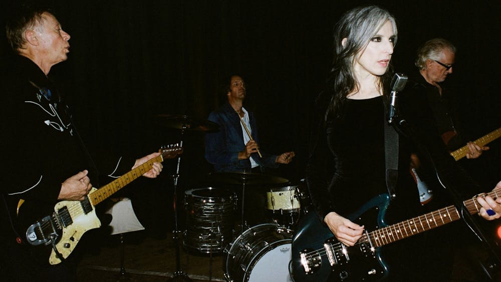 Photo of the members of Bleak Squad with their instruments playing