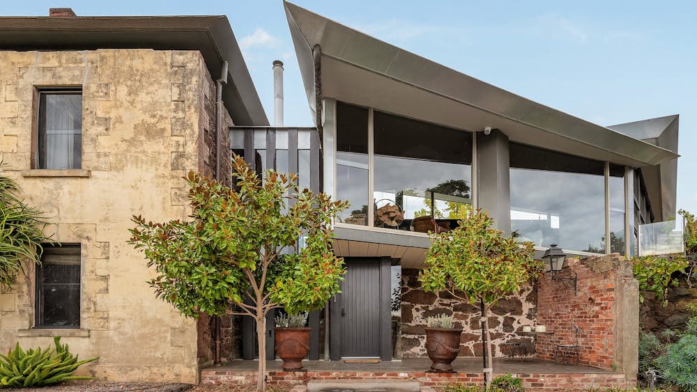 Enter though the double story entrance of Vale House house