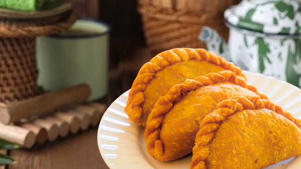 Malaysian curry puffs with crispy pastry and spiced filling.