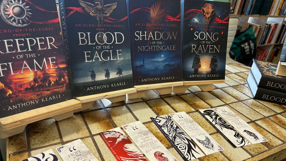 selection of books on a stand by the author