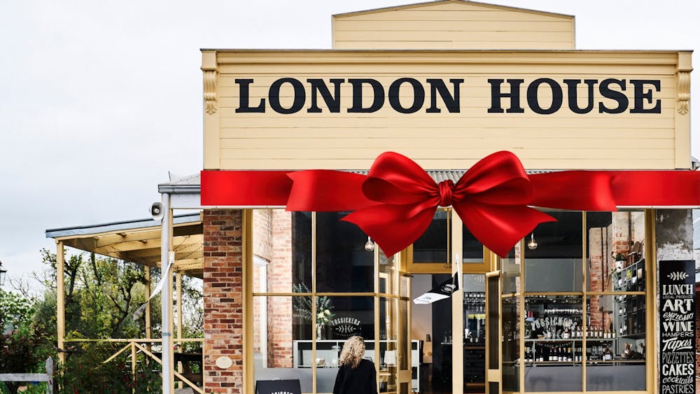London House Building with Christmas Bow