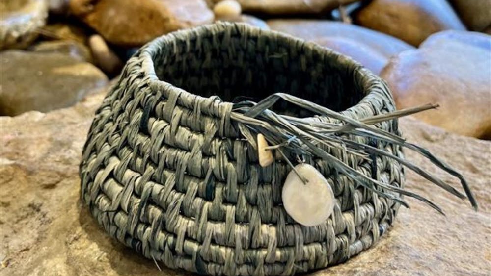 woven basket with stone details.