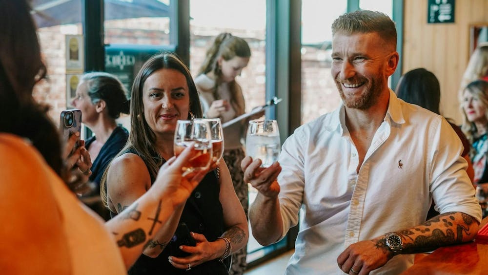 People drinking wine and having a fantastic time