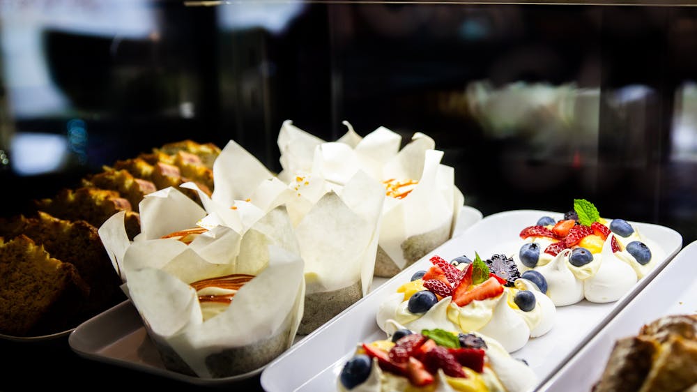 Cakes and slices presented in a display fridge..