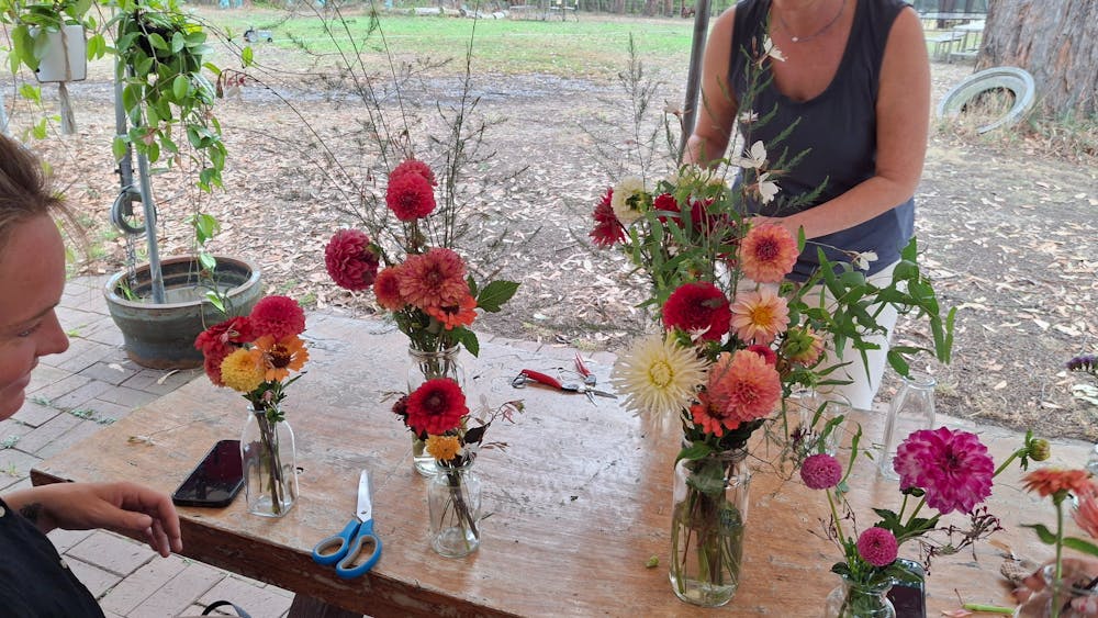 Arranging a mason jar from flowers picked at The Paddock Lal Lal