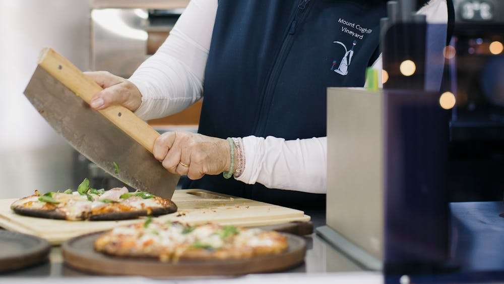 Tracey cutting pizza in the Food Van Clara