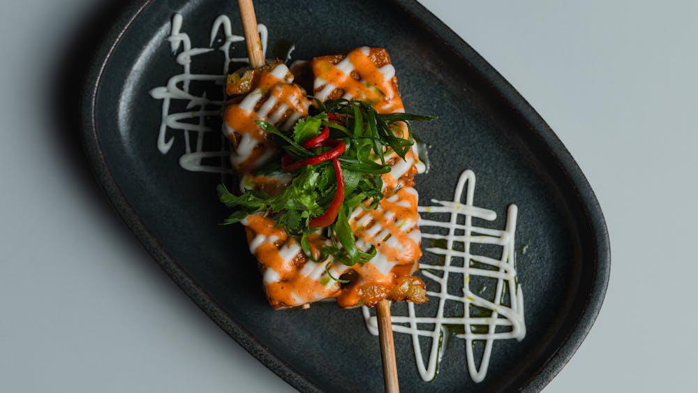 Crispy fried tofu and pineapple skewers topped with a sriracha based bang bang sauce