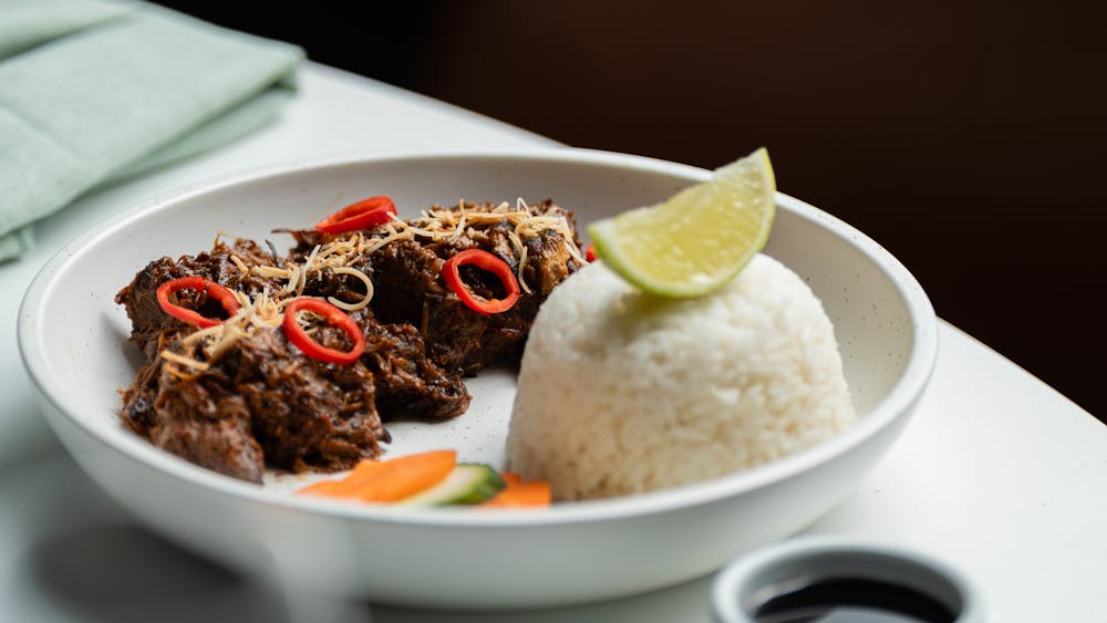 a tender beef cheek, marinated in traditional spices and expertly cooked to perfection