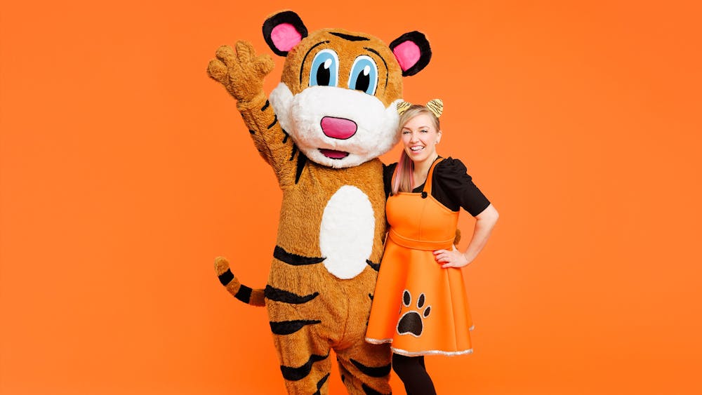 A photo of Pevan & Sarah on an orange background