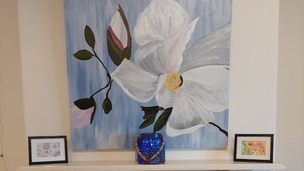 Juliette presents a beautiful white acrylic magnolia on a pale blue canvas.