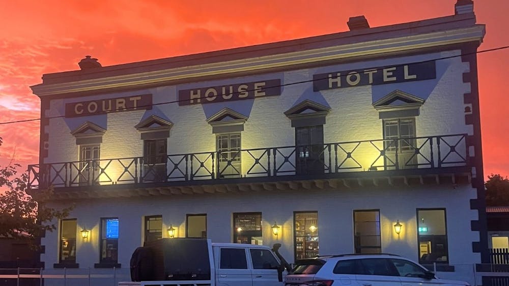 exterior of the courthouse hotel at sunset
